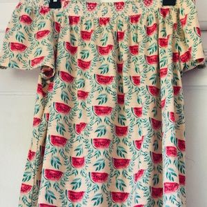 watermelon shirt, shows shoulders